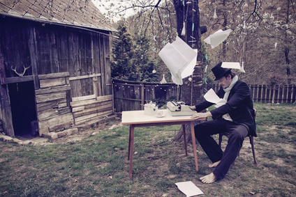 Vintage Outdoor Writer is Writing a Novel Book on Typewriter